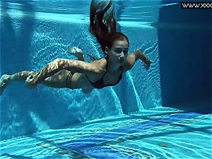 Tiffany Tatum disrobes bare underwater